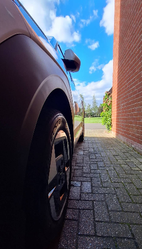 Clean alloy wheel and tyre on a driveway